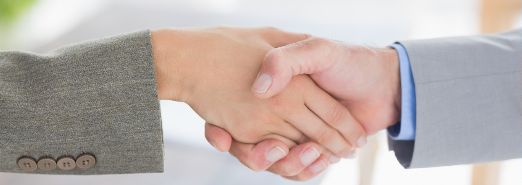 elderly couple posing with sky in the background